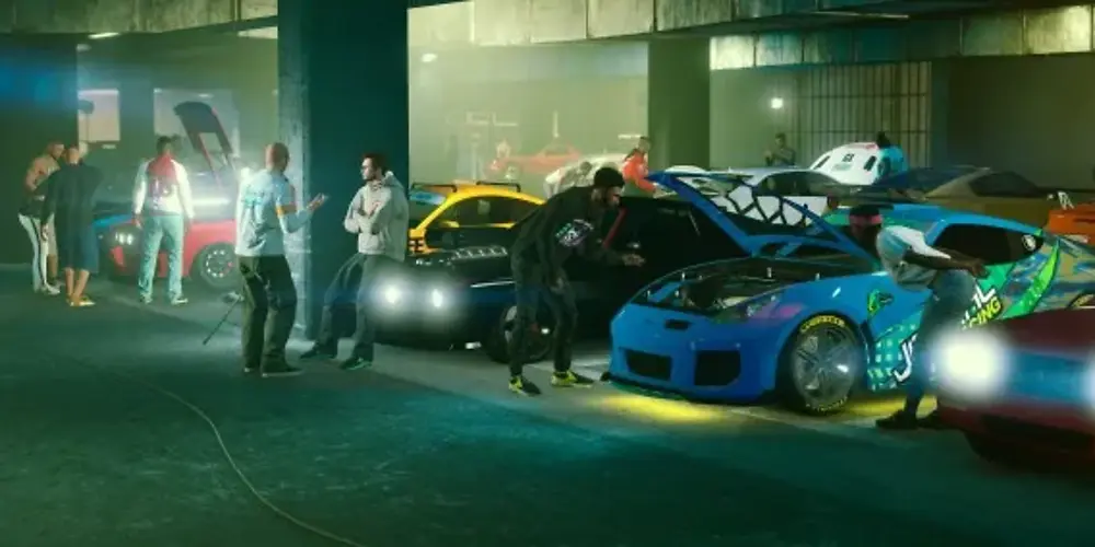 GTA Online players gathered around sports cars with their hoods open, lit by underglow neons, inside a garage