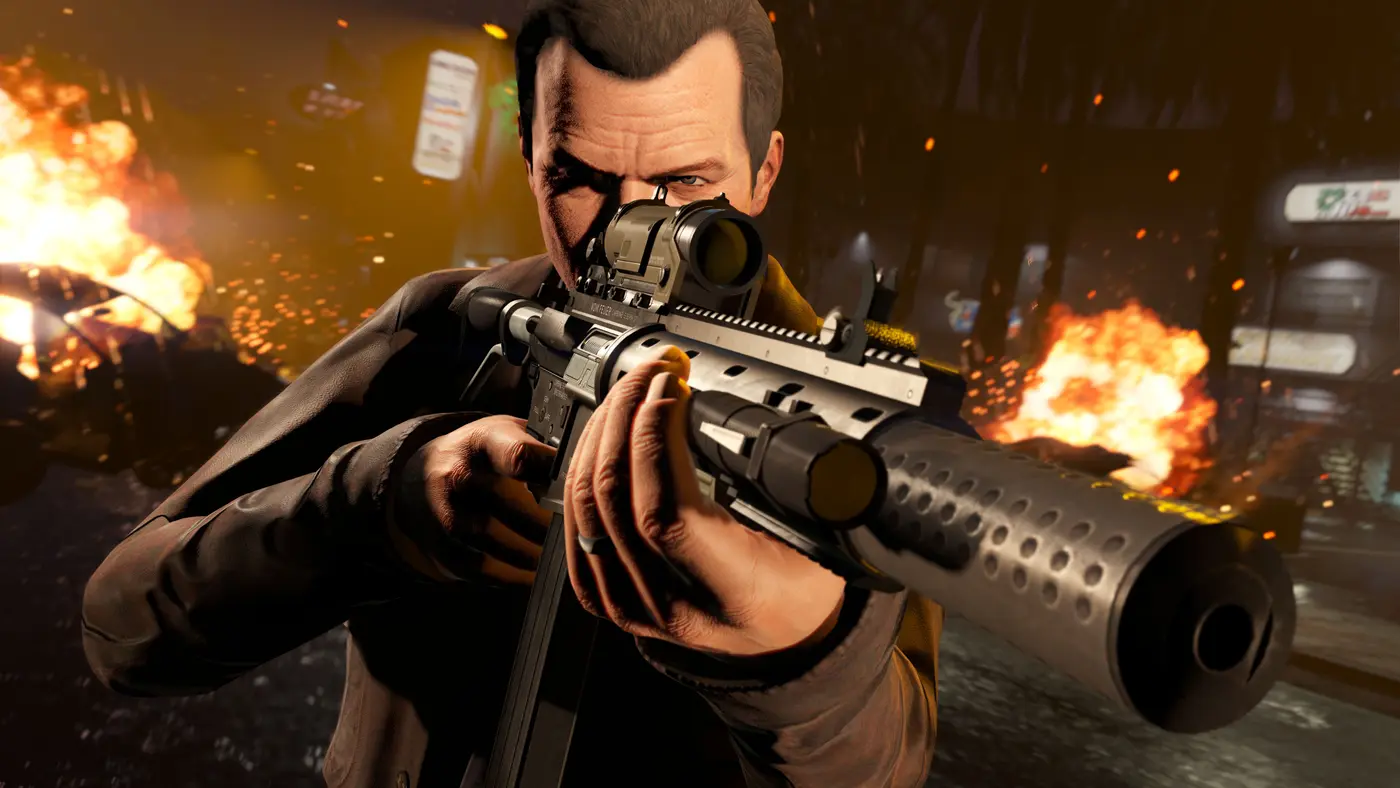 Official GTA 5 screenshot: Michael De Santa aims a rifle fitted with a scope and a suppressor, with explosions and neon signs behind him