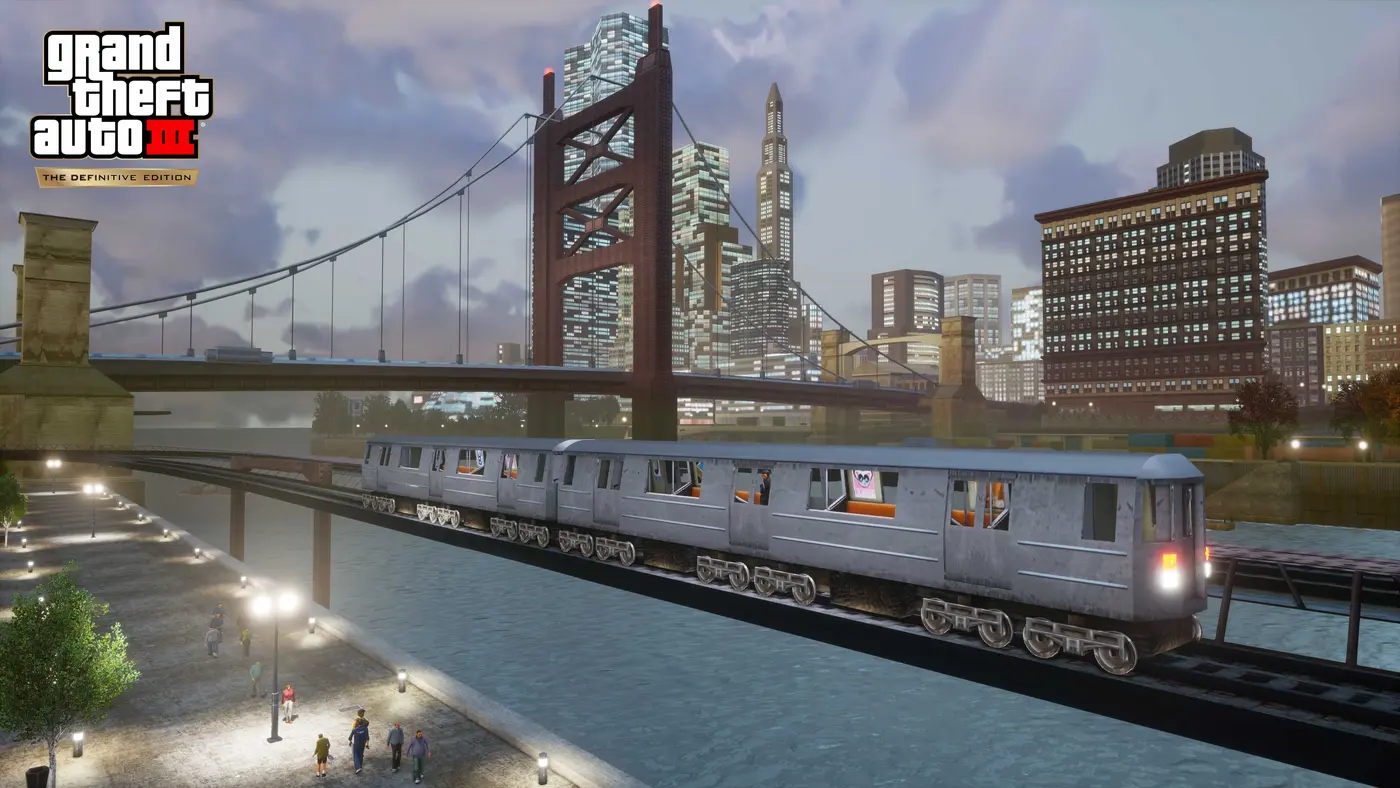 Official screenshot from GTA III The Definitive Edition: an elevated train crosses a bridge over the water in front of the Liberty City skyline, suspension bridge and skyscrapers under a cloudy sky