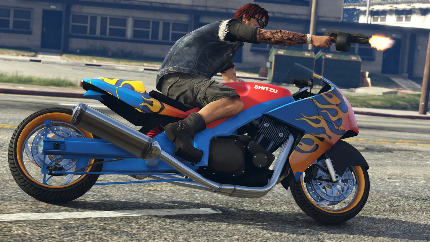A biker fires a submachine gun from a blue and red flame-decorated Shitzu sportbike with a dragster-style extended swingarm, on a Los Santos street in broad daylight