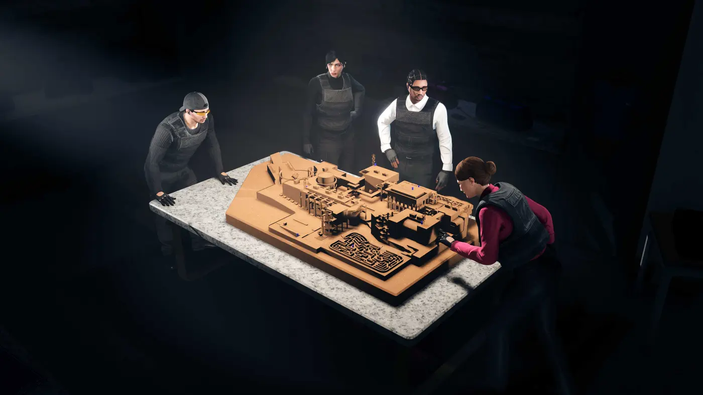 Official GTA Online screenshot: four characters in tactical vests gathered around a table holding a detailed cardboard model of the Kortz Center, complete with its buildings, its hedge maze, and markers planted across it