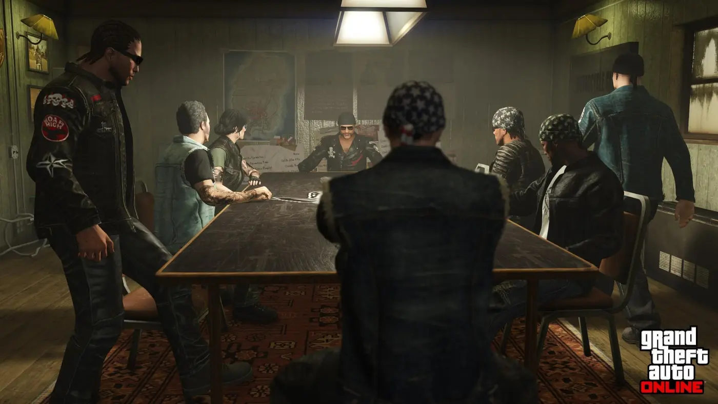 About a dozen Motorcycle Club members in leather vests and bandanas gather around a large table in a clubhouse meeting room, the president seated at the head, a map of the region pinned to the wall