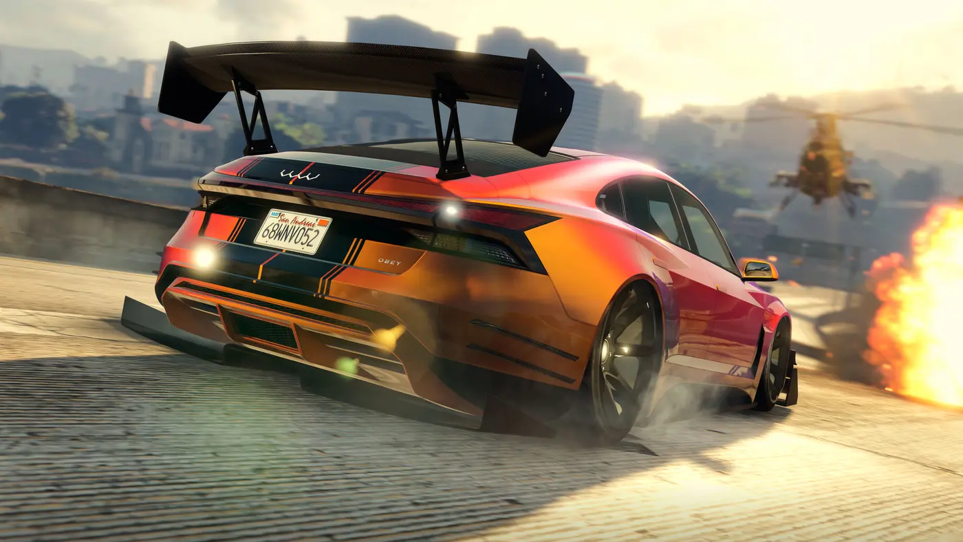Red and orange sports sedan drifting along a Los Santos dock at sunset, chased by an attack helicopter with an explosion on the right