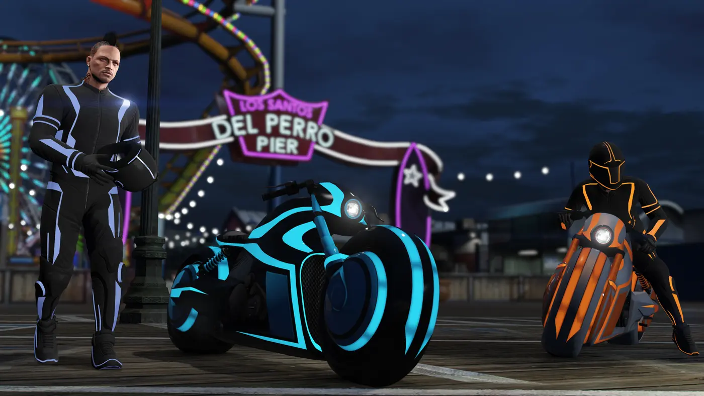 Two Nagasaki Shotaro bikes, one neon blue in profile and the other orange with its rider, on the lit-up Del Perro Pier at night, next to a man in a glowing suit holding his helmet