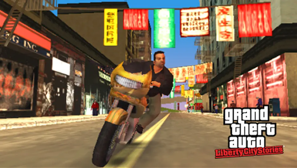 Toni Cipriani in a dark jacket riding a yellow motorcycle down a Chinatown street in Liberty City, with lanterns and red signs hanging above the road