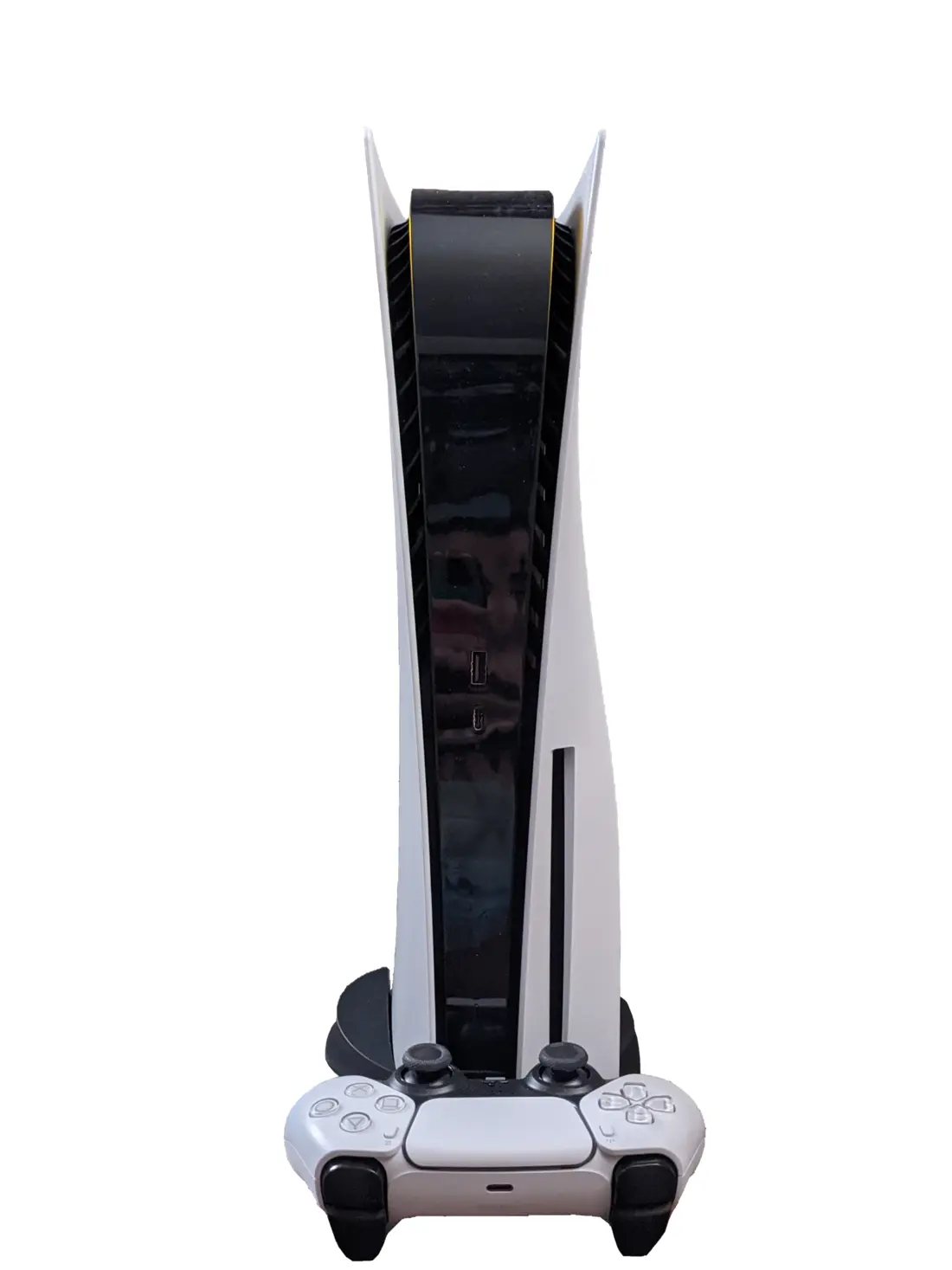 A white PlayStation 5 (disc edition) standing vertically on its stand, with a white DualSense controller, on a white background