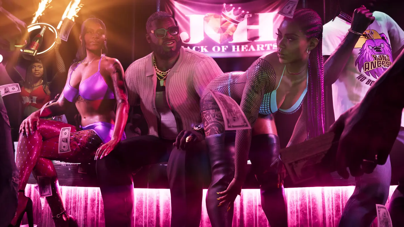 A man in a light vest, gold chain and sunglasses sitting in a VIP booth of a club lit in pink neon, surrounded by dancers, cash flying through the air beneath a Jack of Hearts banner