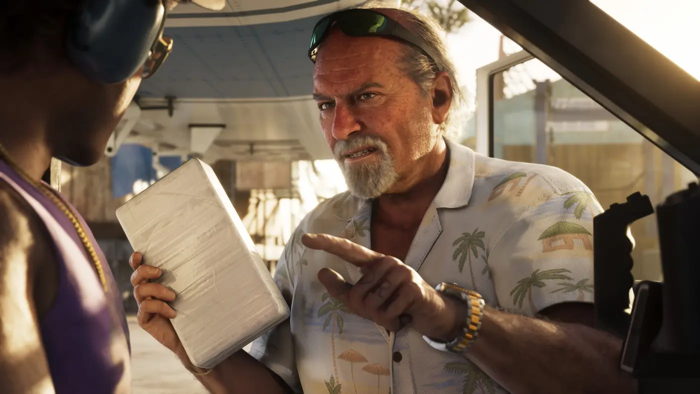 A close-up in golden late-day light in GTA 6: an older man with a weathered face, sunglasses pushed up on his forehead, a palm-print shirt and a gold watch, talking to another character