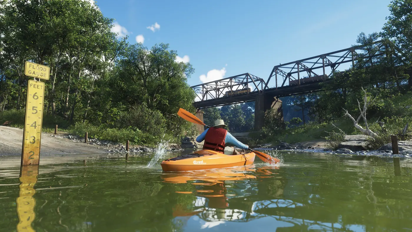 A person in an orange kayak on a calm river in GTA 6's Mount Kalaga National Park, a metal railway bridge in the background, vegetation and reflections on the water