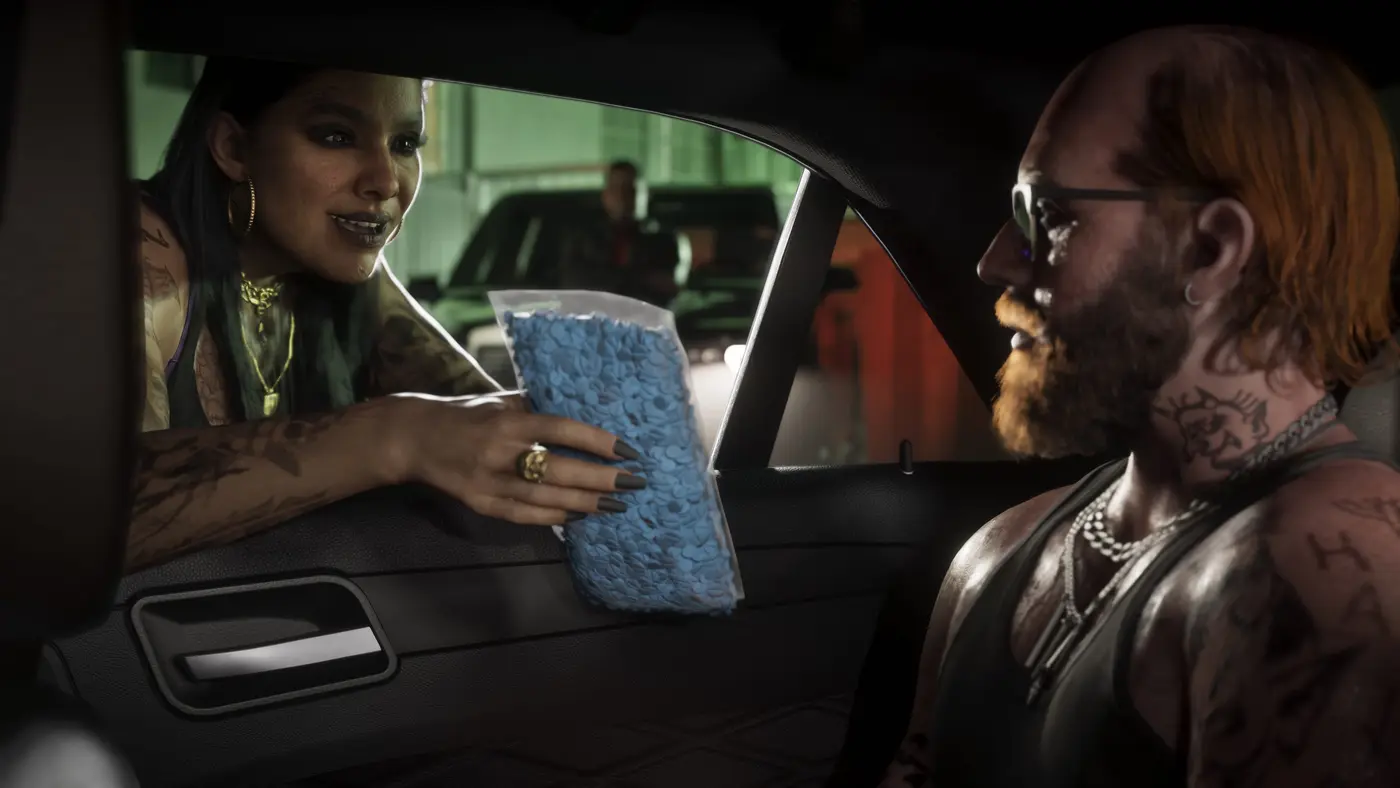 A car-window exchange in GTA VI: a tattooed woman hands a plastic bag of blue pills to a bearded man in a tank top, in a green-lit garage