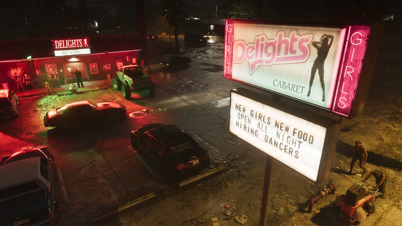 Nighttime parking lot of the 'Delights' nightclub in Port Gellhorn in GTA VI: a pink neon sign with a dancer's silhouette, cars and a green buggy parked on the wet asphalt of a run-down street