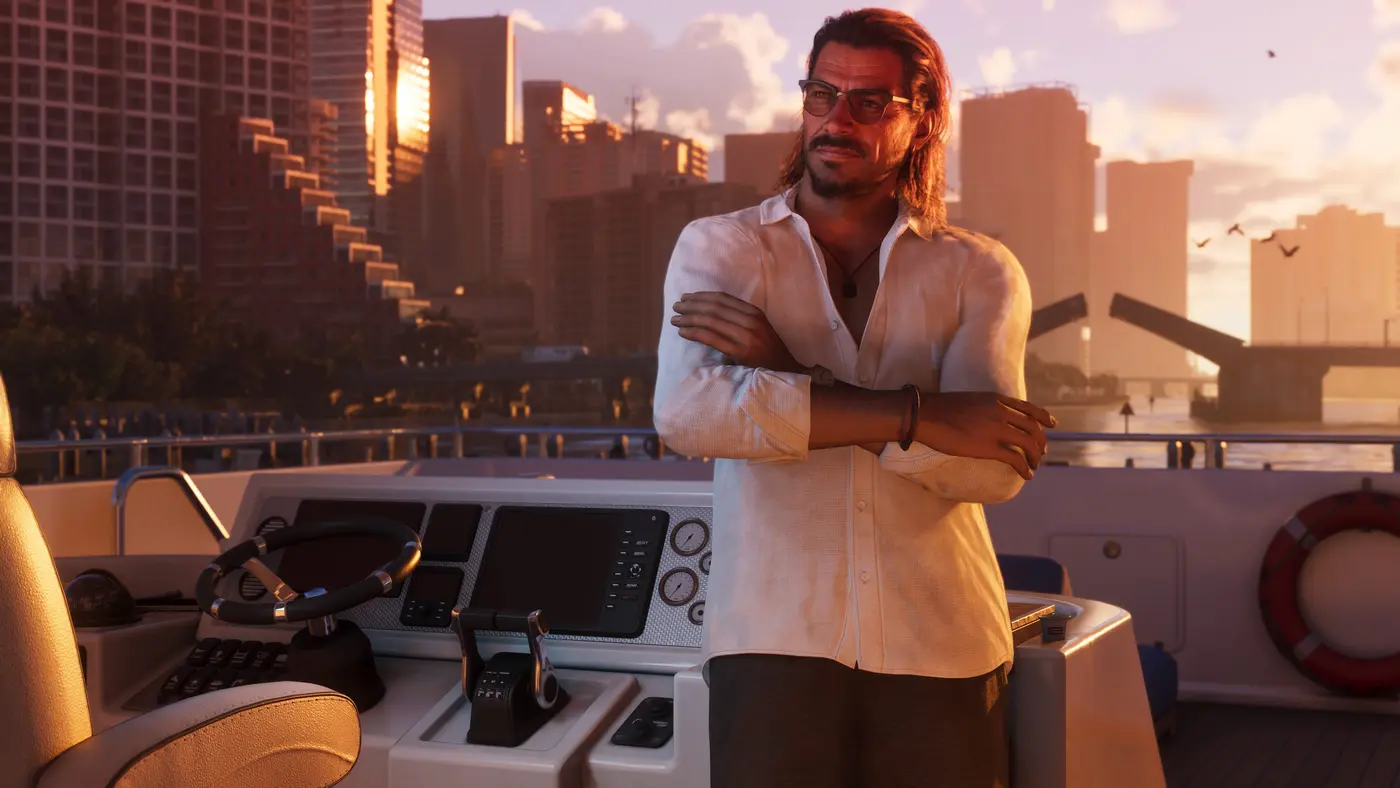 A character with long hair and sunglasses, white shirt, arms crossed at the helm of a yacht in GTA 6, the Vice City skyline bathed in a golden sunset behind him