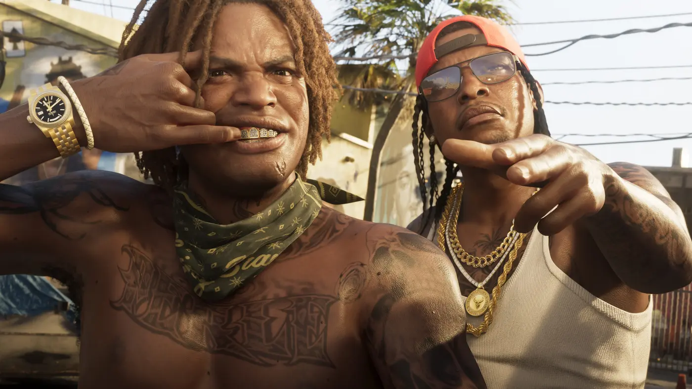 Close-up of two tattooed GTA 6 characters on a sunny Vice City street, one wearing a gold grill and a gold watch, the other in a white tank top and red cap